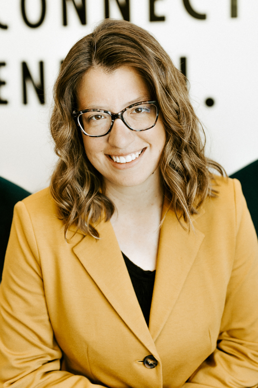Layne Manson Headshot with yellow blazer